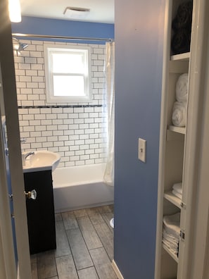 Shower, hair dryer, towels, soap