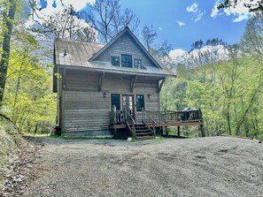 The parking area at The Cabin with room to turn around one car, or park two. 