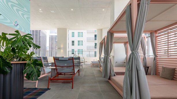 A modern hotel room with a bed, seating area, and large windows. - MirabileCondoDwntown MIA Brickell w PRKG (Miami)