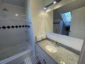 Jetted bath, hair dryer, bidet, towels