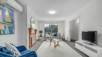 Apartment | Living area | 55-inch Smart TV with digital channels, TV, offices