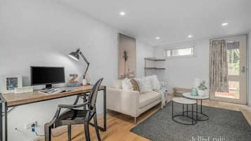 Apartment | Living area | 55-inch Smart TV with digital channels, TV, offices