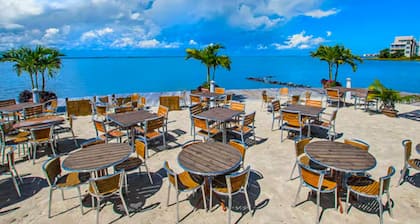 Spacious beachside home with fireplace, washer/dryer, pools, dock, & gym