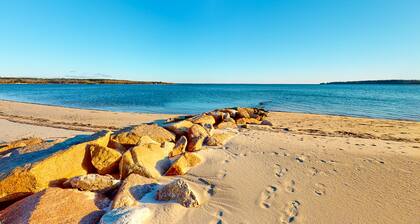 Dog-friendly coastal home steps from beach with grill, firepit, & washer/dryer