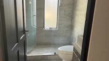 Shower, towels, soap, shampoo