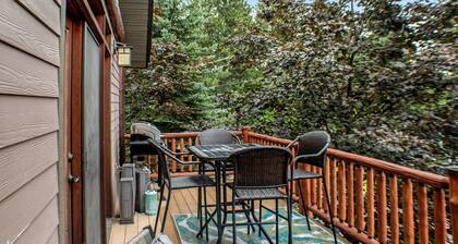 Updated condo with peek-a-boo lake views, deck, W/D, fireplace, & lake access