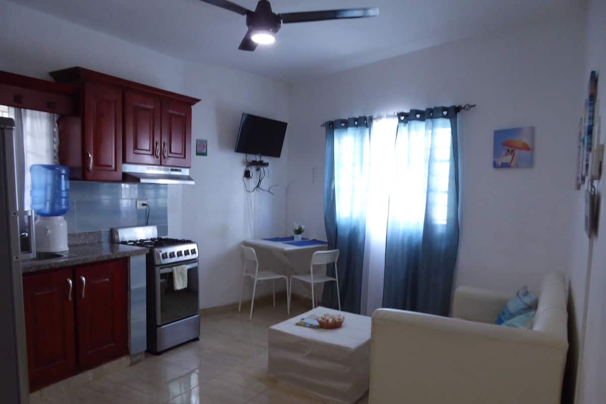 Comfort Apartment | Living area | 32-inch flat-screen TV with cable channels, TV, Netflix
