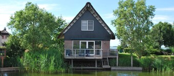 Villa on the water with sauna in Friesland