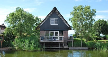Villa on the water with sauna in Friesland
