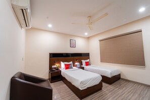 Deluxe Room | Desk, laptop workspace, blackout curtains, soundproofing - Playsales Eco Stay (Indore)