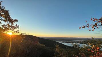 A mountainous landscape with a lake and a clear sky.