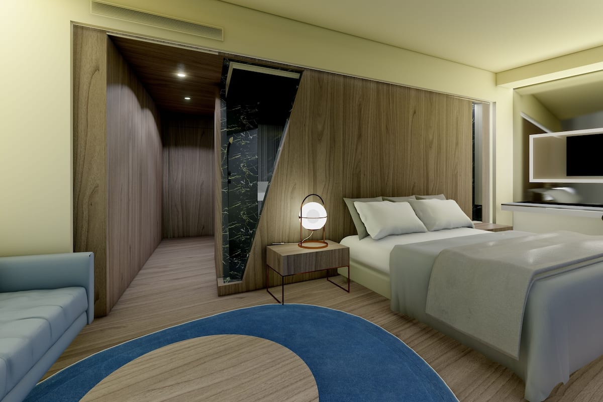 Une chambre d’hôtel moderne, équipée d’un lit, d’une table de chevet, d’une lampe et offrant une vue sur le ciel nocturne.