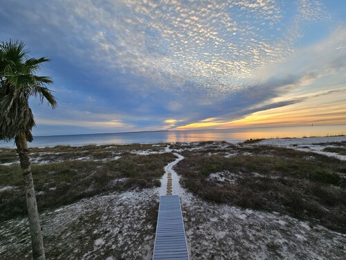 Beachfront home with beautiful view of beach and ocean.
