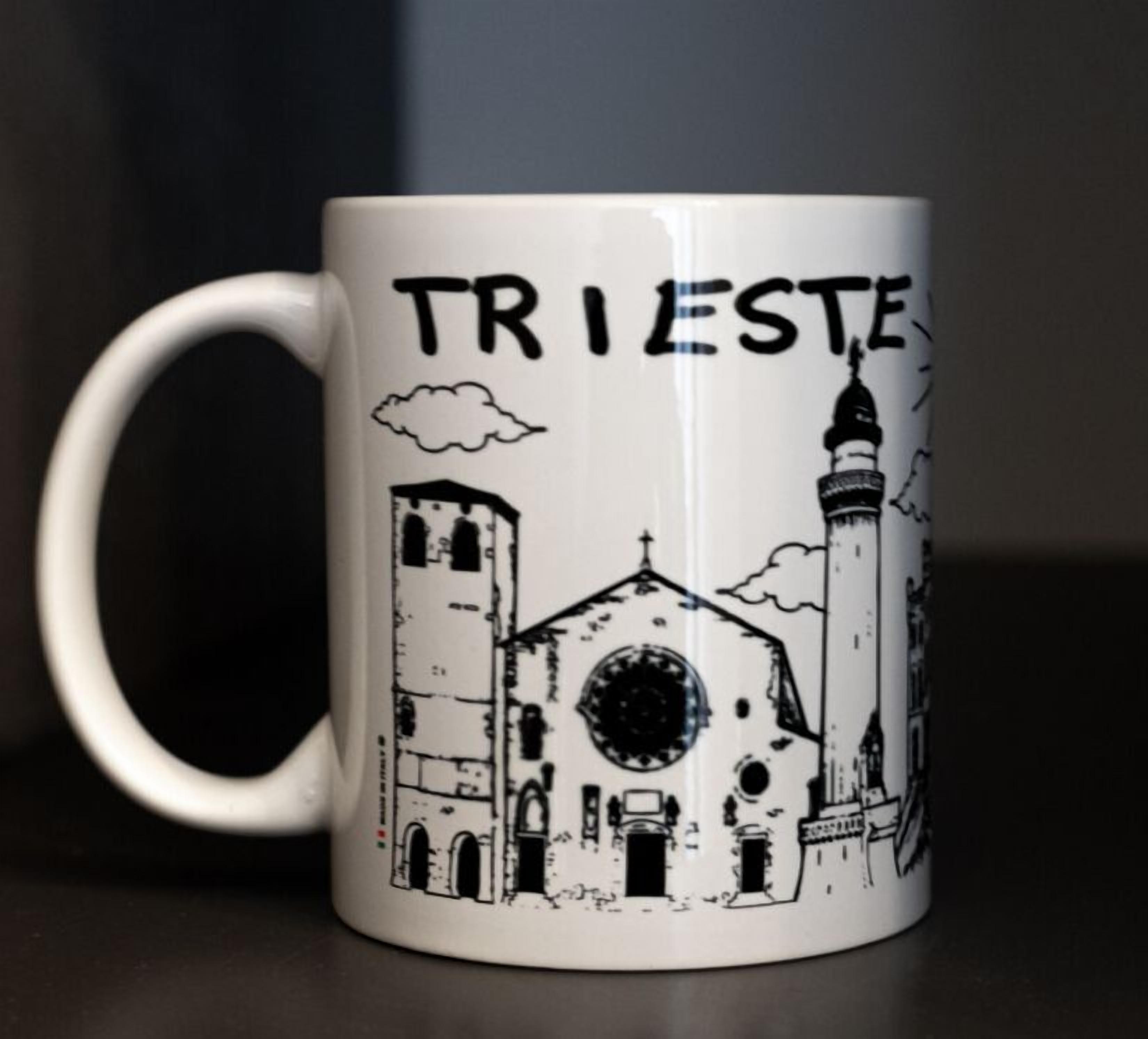 A white mug with a black illustration of a church and the word "TRIESTE" on it.