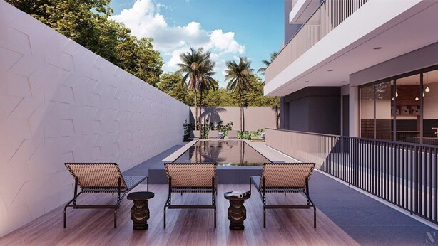 A modern outdoor patio with a pool, seating area, and a view of a building with large windows. - SB Setin Brooklyn Studios (São Paulo)