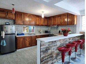 Enjoy cooking in this well-equipped kitchen with an island and microwave.