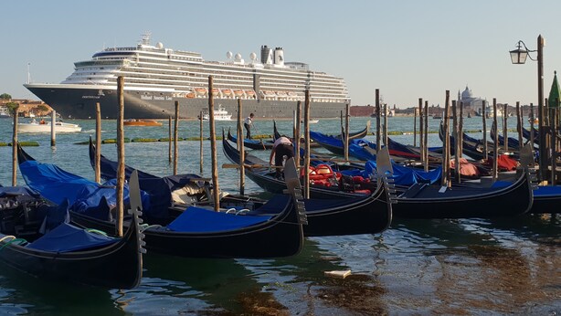 A cruise ship docked at a harbor with gondolas lined up in the foreground. - "BIGHOUSE" VENICE CENTER NEW AND LUXURY FLAT (Venezia)
