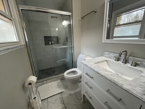 Shower, hair dryer, towels, soap