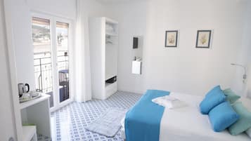 Habitación doble Deluxe | Edredón, camas con pillow-top y caja de seguridad en la habitación