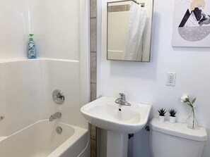 Bathtub, hair dryer, towels