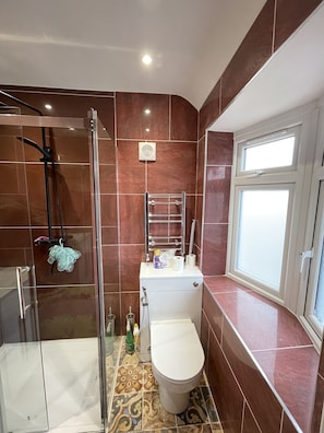 Shower, hair dryer, towels, soap