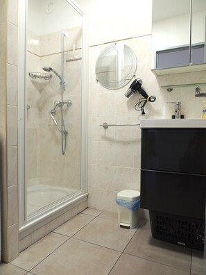 Shower, hair dryer, towels, soap