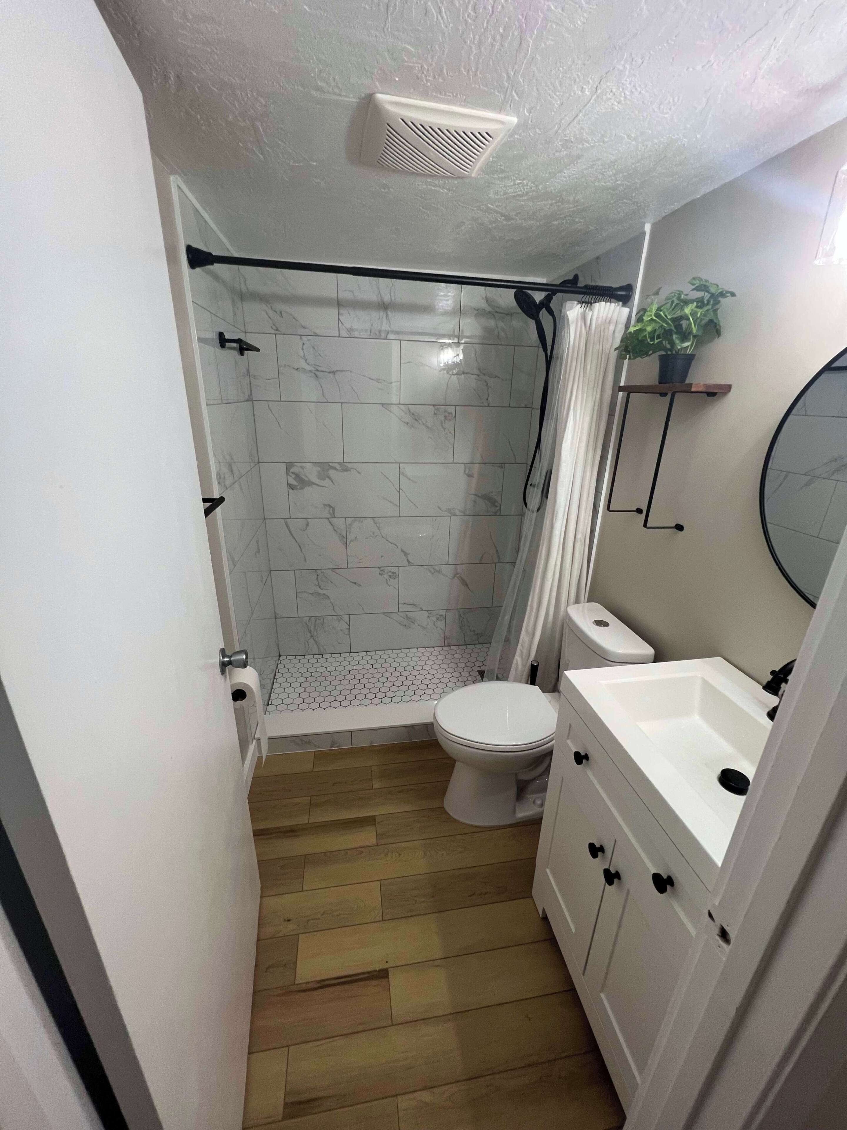 Shower, hair dryer, towels, shampoo