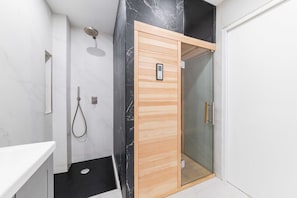 Shower, hair dryer, towels, shampoo