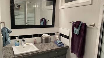 Shower, hair dryer, towels, soap