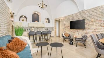 Elite Apartment | Living area | 55-inch flat-screen TV with cable channels, TV