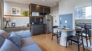 A modern apartment with a kitchen, dining area, and living room. - VN Ferreira Lobo (São Paulo)
