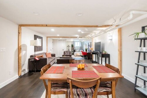 A pied-à-terre near bistros, shops, and sports stadium w/ parking and EV charger