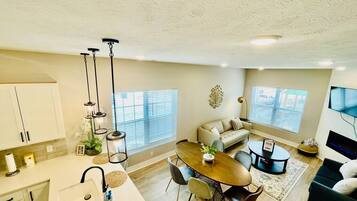 TV, fireplace, books, offices