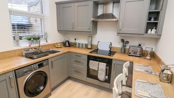 Fridge, electric kettle, toaster, cookware/dishes/utensils
