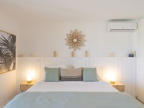 1 bedroom, desk, iron/ironing board, travel crib