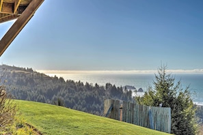 Panoramic views of a serene coastal landscape unfold from this elevated vantage point.