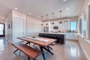 Enjoy meals and social gatherings around the central island with microwave and bar stools.