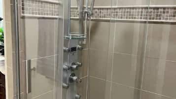 Shower, hair dryer, towels, soap