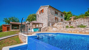 A stone building with a swimming pool. - Beautiful home in Labin (Labin)