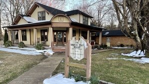 A house with a sign reading "The Spelling House Museum." - Loft apartment on Clifton, TN  Main Street Convenient, Cozy and Clean <br> (Clifton)