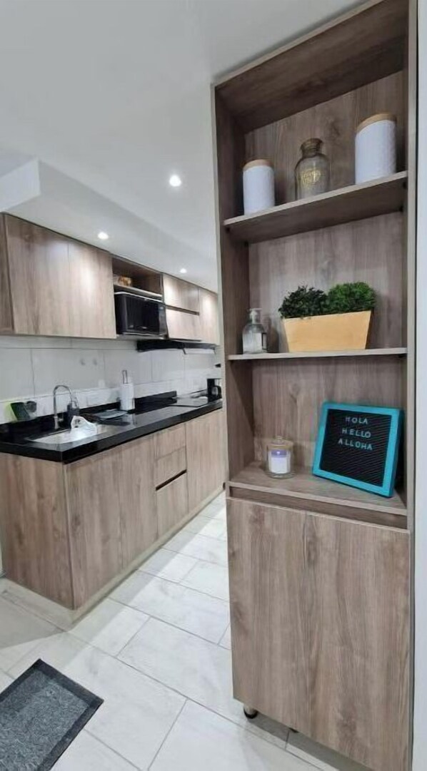 Microwave, cookware/dishes/utensils, dining tables