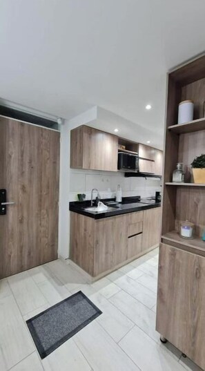 Microwave, cookware/dishes/utensils, dining tables