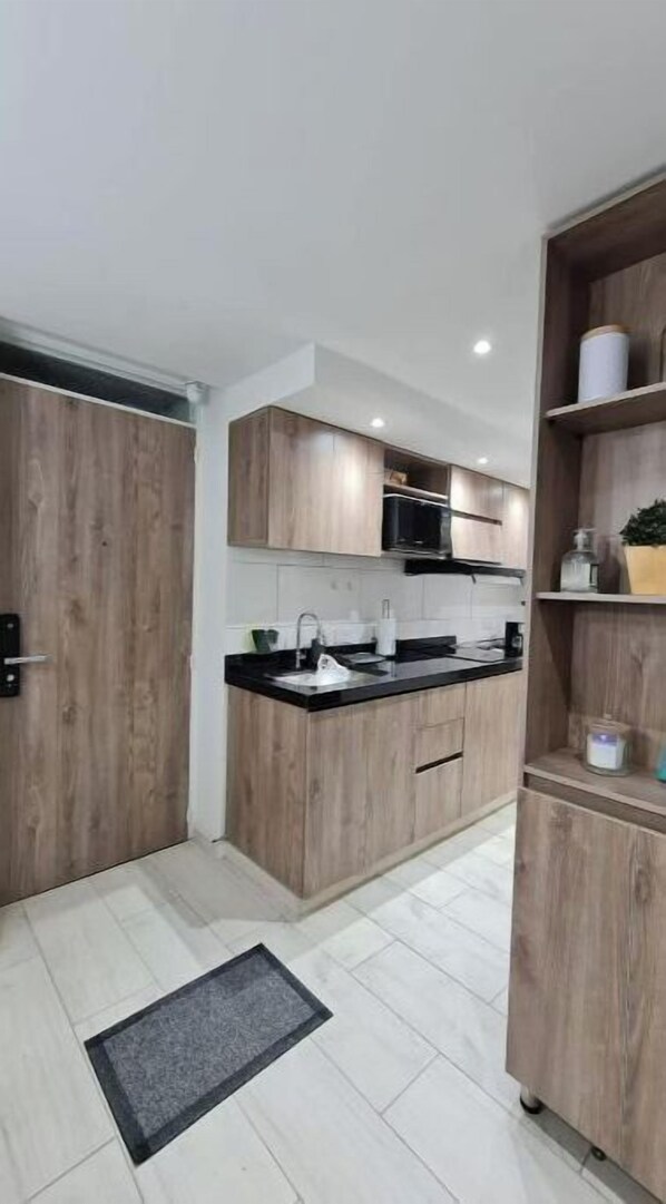 Microwave, cookware/dishes/utensils, dining tables