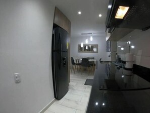 Microwave, cookware/dishes/utensils, dining tables
