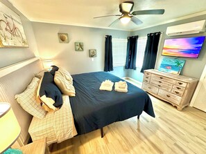 1 bedroom, desk, iron/ironing board, travel crib