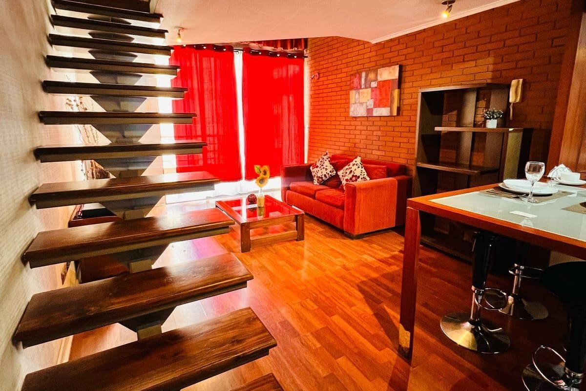 Apartamento Deluxe | Zona de estar | Smart TV de 32 pulgadas con canales por cable, una televisión