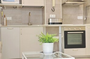Fridge, oven, coffee/tea maker, cookware/dishes/utensils