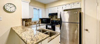 Enchanting dog-friendly condo with pool, balcony, full kitchen, & washer/dryer