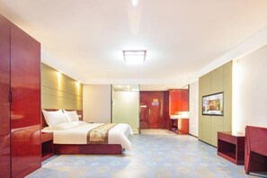 A hotel room with a bed, wardrobe, bedside table, and a door leading to another room. - IU Hotel (Yanshi Baima Temple) (Luoyang)