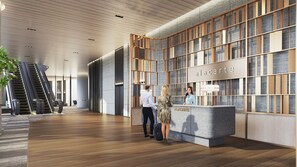 Welcome to Alacarte, where guests can check in at the reception desk and enjoy a view of the outside from the large window.